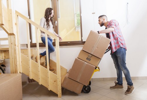 Team of house removalists transporting items in Lambeth